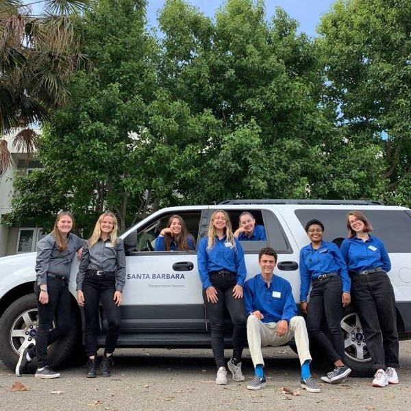 Student staff posing infront of a UCSB van.