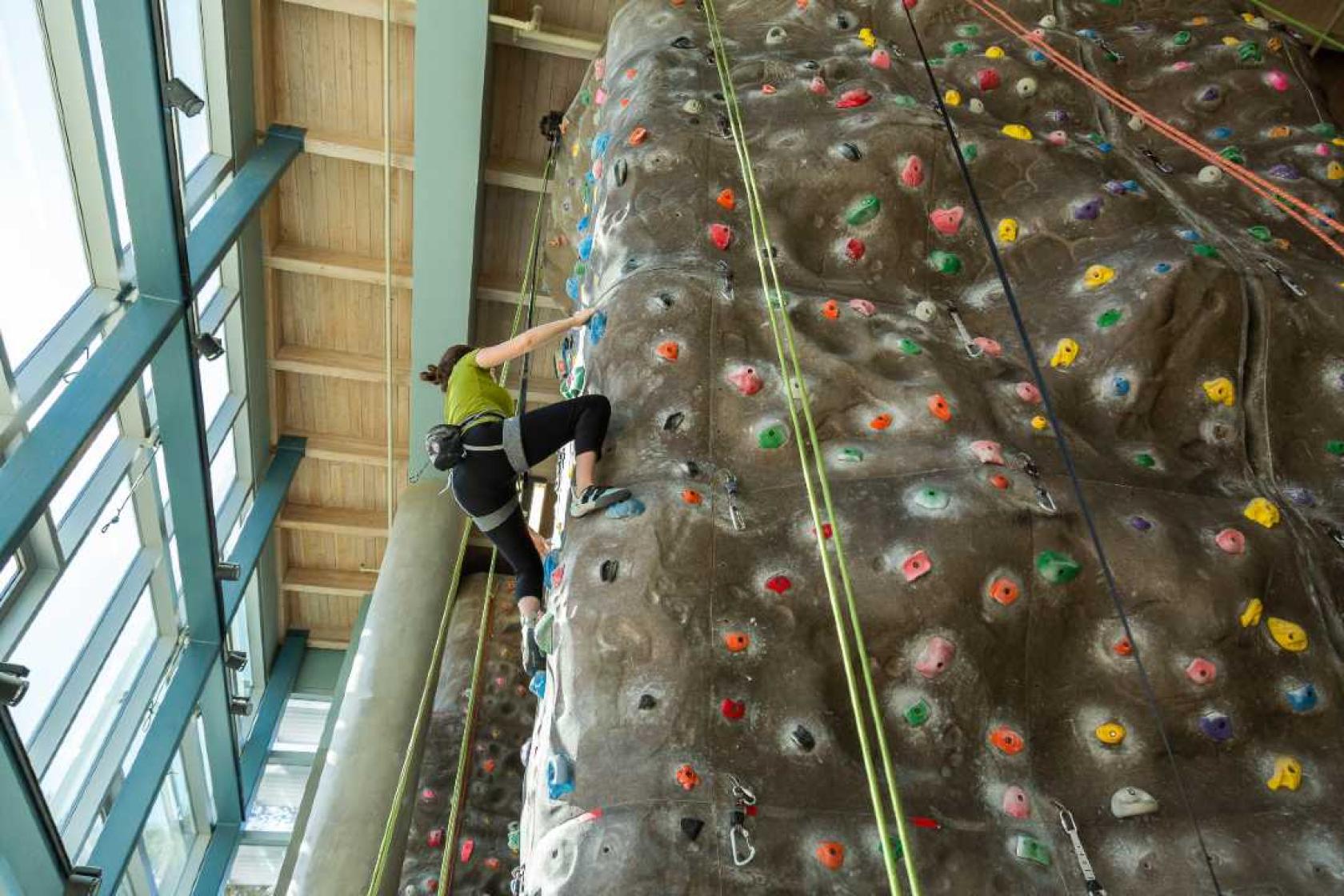 Person on a climbing wall.